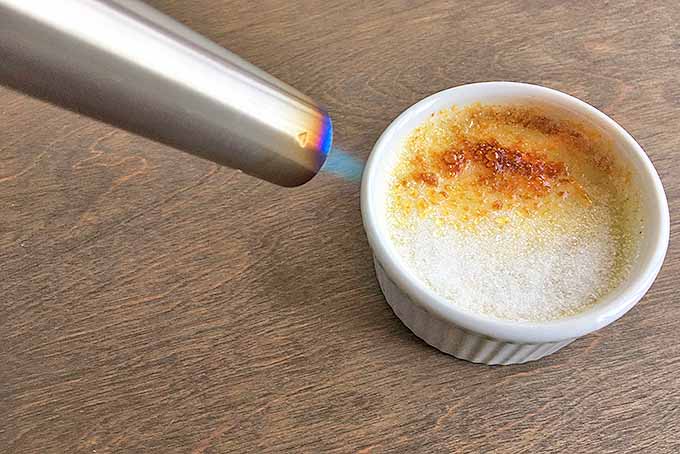 Torching granulated sugar for creme brulee. | Foodal.com