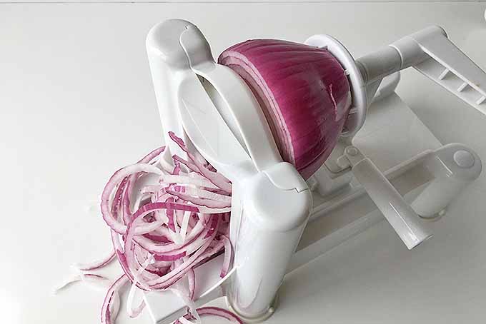 Spiralizing red onions for a fresh salad. | Foodal.com