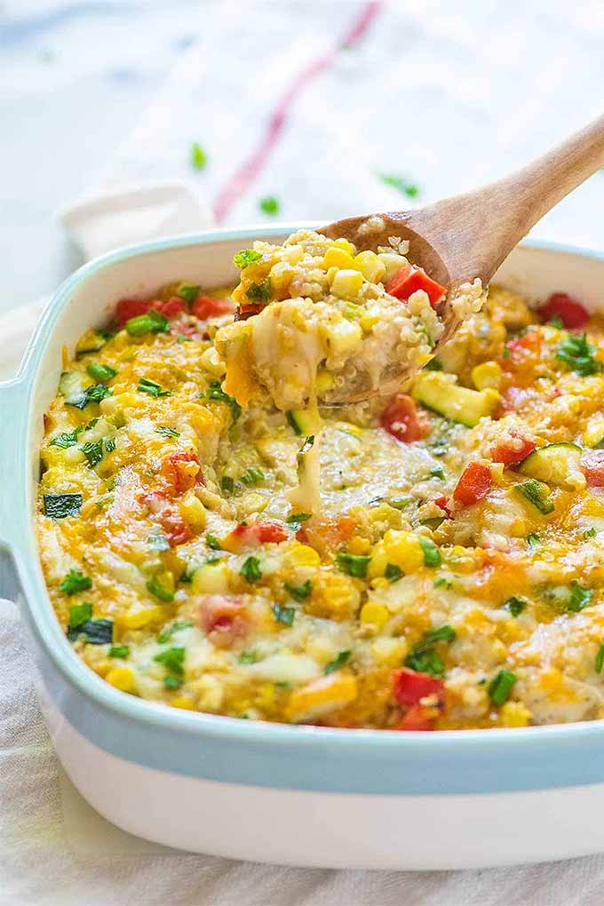 Quinoa, corn, chicken and cheese- this casserole makes a delicious summertime dinner! Get this recipe and more: https://foodal.com/knowledge/paleo/best-sweet-corn-recipes/