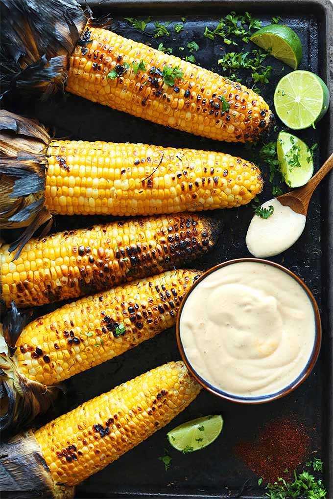 Looking for a spicy sauce to pair with grilled corn on the cob? You'll love this sriracha aioli. Check out our round up for more recipes: https://foodal.com/knowledge/paleo/best-sweet-corn-recipes/