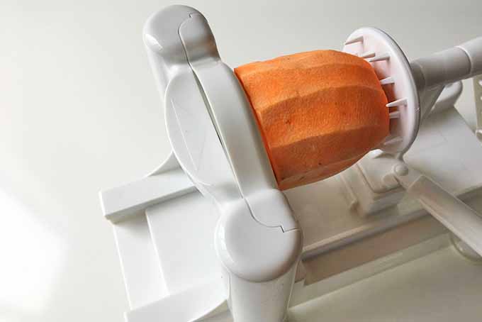 Piercing a Sweet Potato on a Spiralizer | Foodal.com