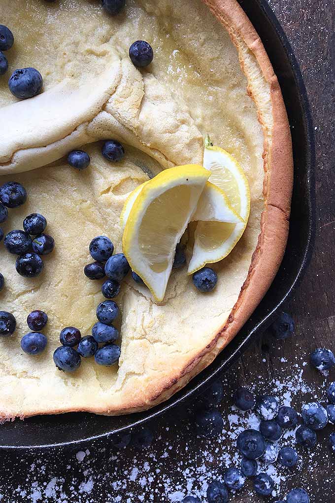 A Dutch baby is a tasty breakfast treat baked in a skillet, and resembles a puffy crater with crispy, golden-brown sides. Learn how to make it now: https://foodal.com/recipes/breakfast/vanilla-dutch-baby/