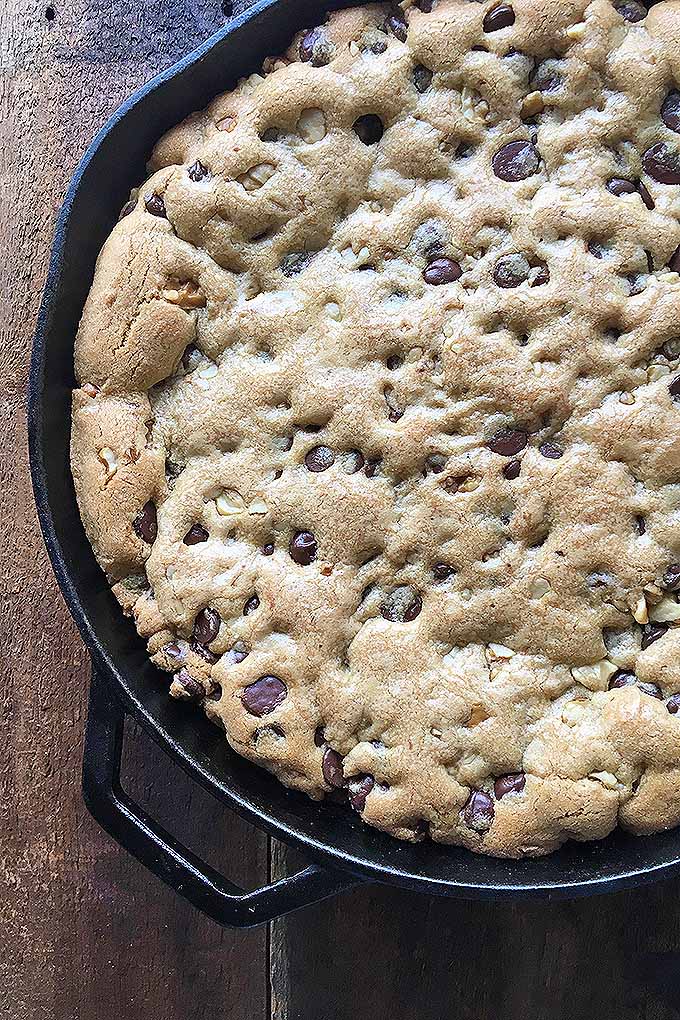 Release your inner cookie monster with our recipe for a giant chocolate chip cookie! Serve it with ice cream at your next party. We share the recipe: https://foodal.com/recipes/desserts/pan-cookie/