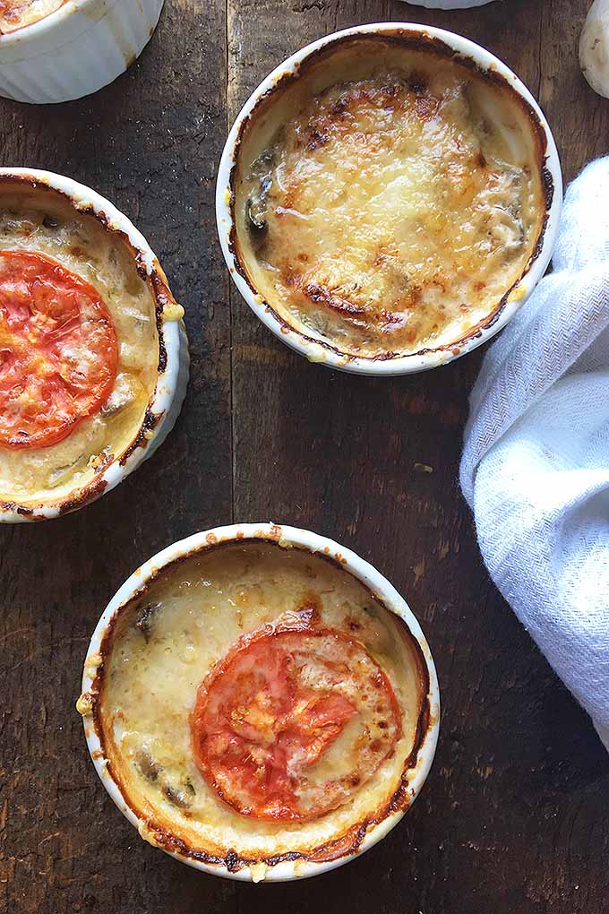 Meaty mushrooms are the perfect vegetarian base for one of our favorite comfort food dishes, topped with a tomato and gooey cheese. We share the recipe now: https://foodal.com/recipes/comfort-food/mushroom-julienne-with-tomato-and-cheese/