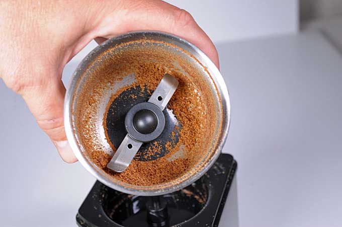 A blade style coffee grinder used to grind nutmeg.