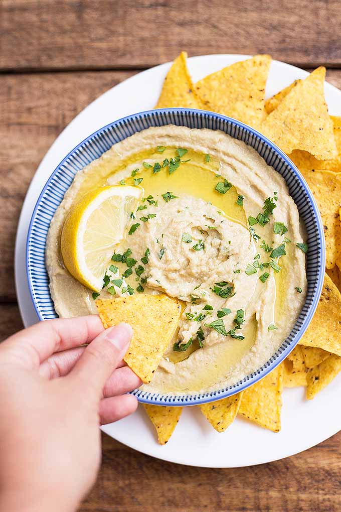 Our hummus is mixed with roasted eggplant and garlic, a perfect baba ghanoush inspiration! Make the recipe now: https://foodal.com/recipes/appetizers/baba-ghanoush-hummus/