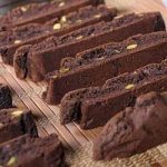 Close up of even rows of chocolate pistachio biscotti cookies | Foodal