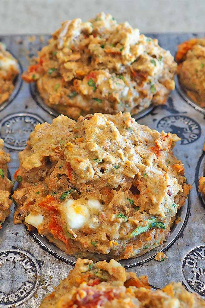 Sue's Savory Muffins are made with spelt flour, sun-dried tomatoes, crumbled feta, and ham or chicken- perfect for a quick lunch or afternoon snack! We share the recipe: https://foodal.com/recipes/breakfast/sues-savory-muffins/