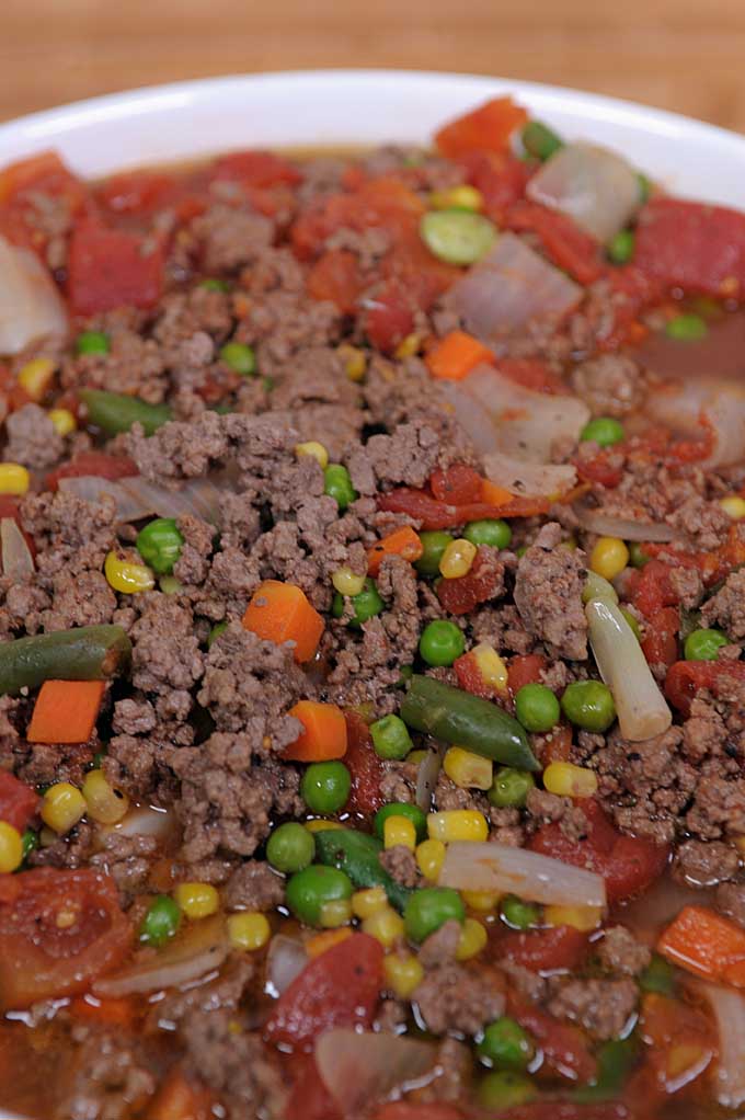 Hamburger soup is a cheap and nutritious way to feed a large family or freeze for later use. Find out more on Foodal now!
