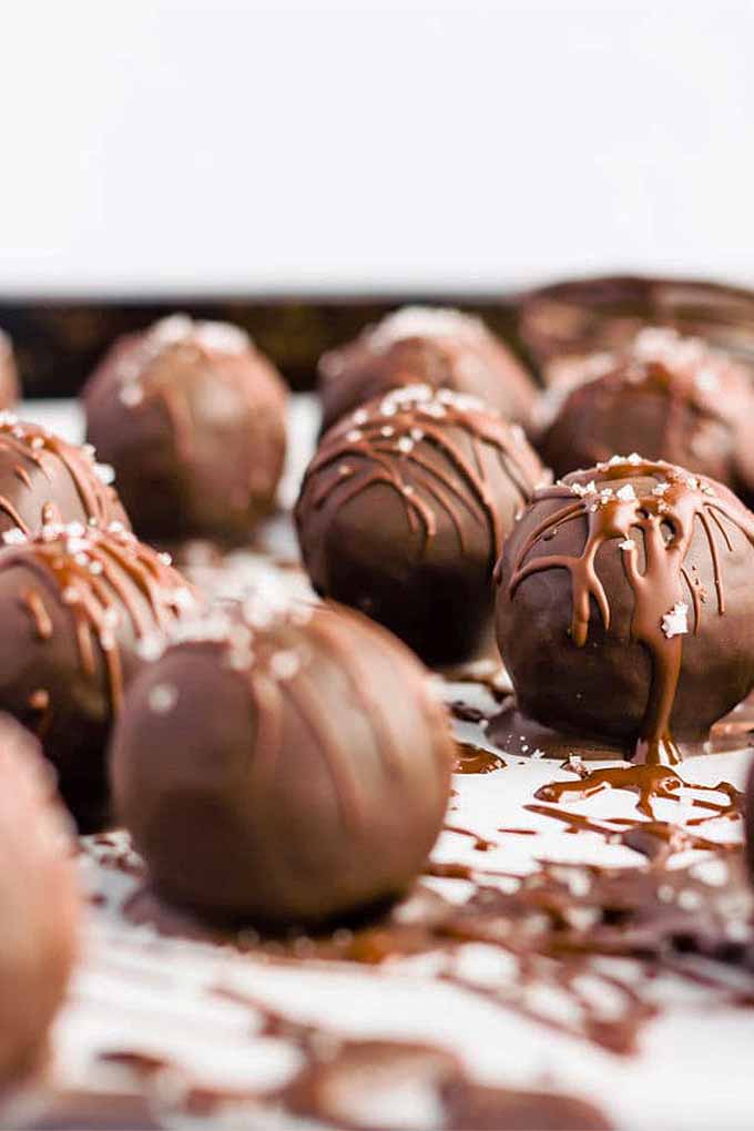 Close-up image of chocolate covered protein balls.