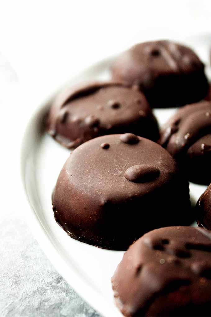 Closeup image of dark chocolate peppermint candies.