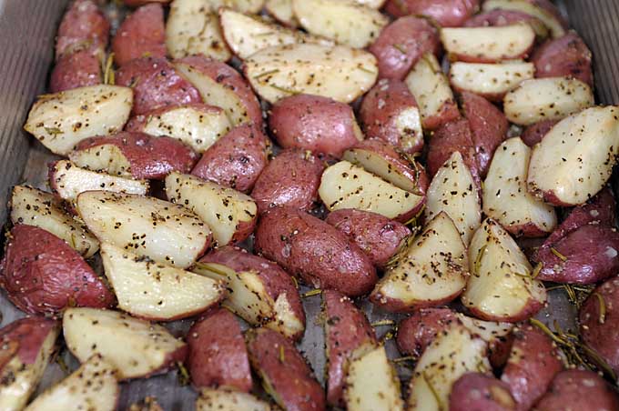 Close up of a pan of roasted rosemary red potatoes | Foodal