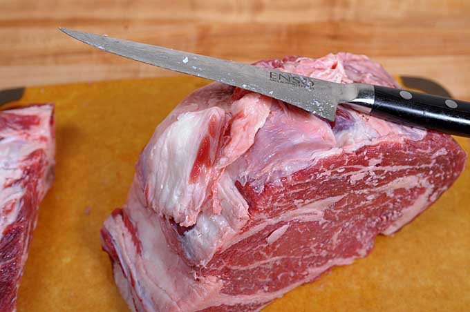 A standing rib roast with much of the fat removed from the fat cap | Foodal