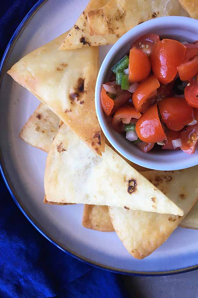 It's so easy to make homemade tortilla chips! Simply fry soft corn or flour wraps in oil to get crispy triangles perfect for dipping in your favorite salsa, guacamole, or hummus. We share the recipe: https://foodal.com/recipes/snacks/homemade-tortilla-chips/