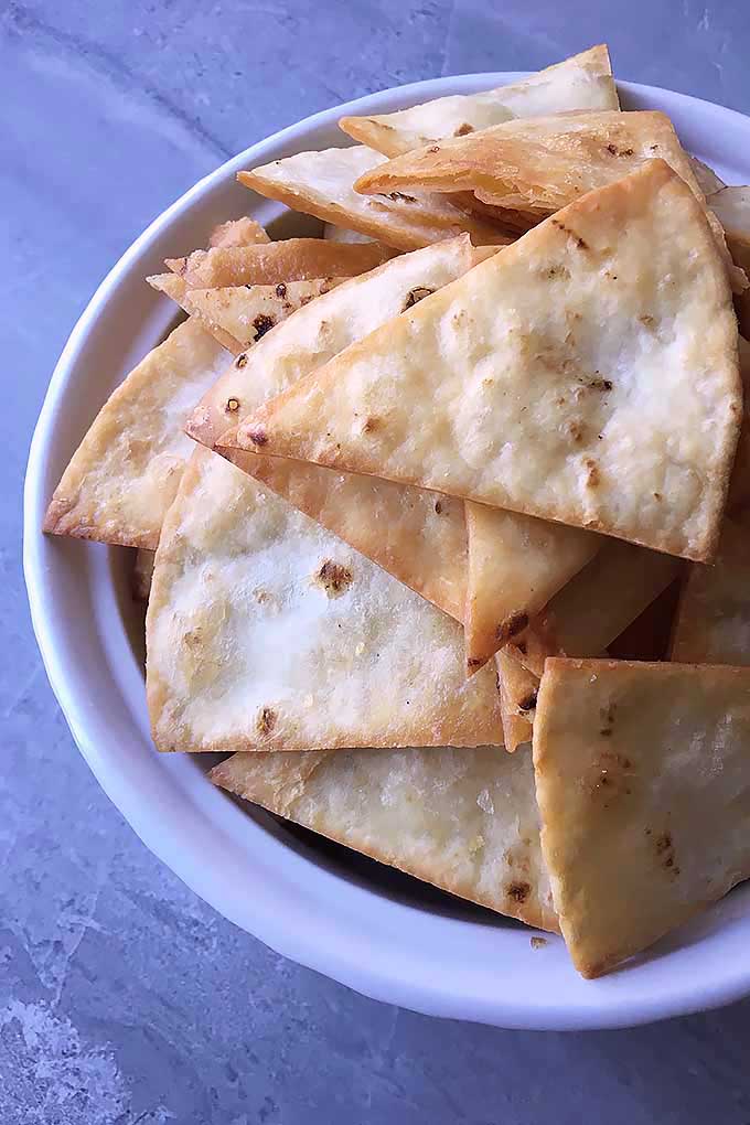 Learn how to make homemade tortilla chips in just a few minutes, using soft flour or corn tortillas fried in oil. We share this super-easy recipe now: https://foodal.com/recipes/snacks/homemade-tortilla-chips/