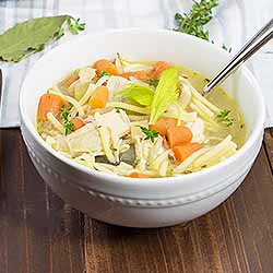 Chicken noodle soup with bay leaf and thyme. | Foodal.com