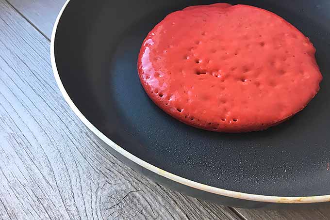 Cooking the First Side of a Red Velvet Pancake | Foodal.com