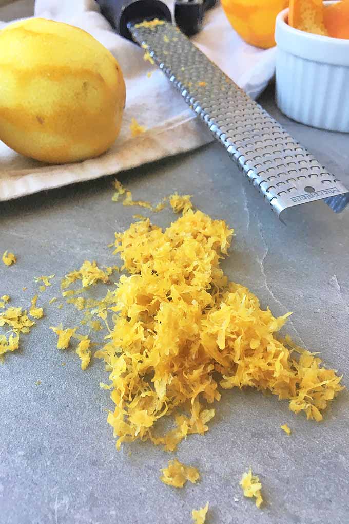 A pile of lemon zest with a microplane.