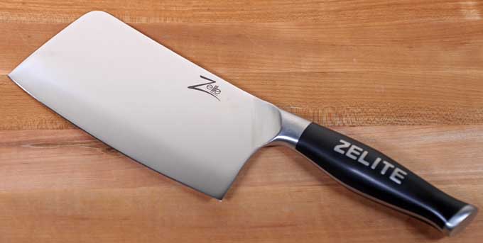 Zelite Medium-Weight Meat Cleaver on a maple butcher board.