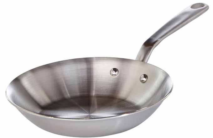 Horizontal image of a metal frying pan.