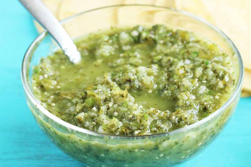 A close up of a bowl of traditional salsa verde made with tomatillos.