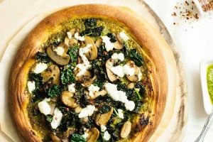 Pesto Pizza with Goat Cheese, Kale, and Mushrooms