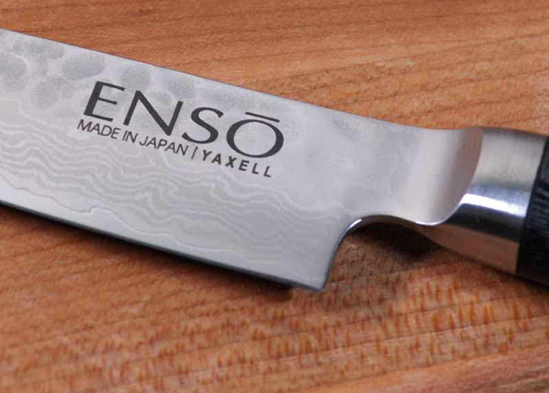 Close up of the hammered and Damascus finish as well as the laser etched logo on the Enso HD petty knife.
