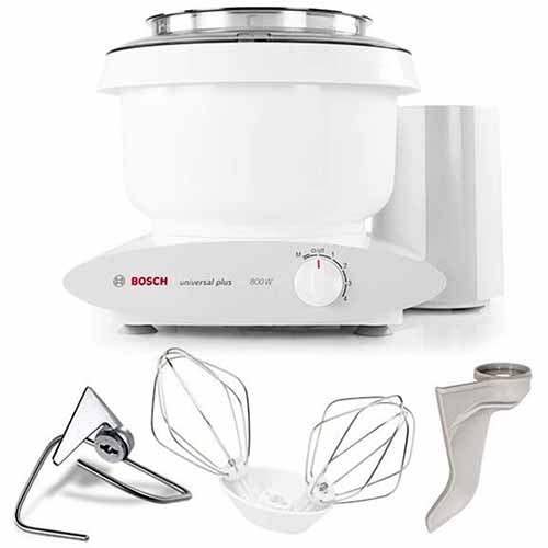 Bosch Universal Plus mixer with attachments, isolated on a white background.