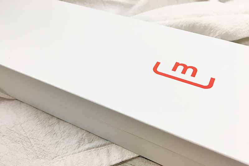 Horizontal closeup image of a box with an "M" in red text.