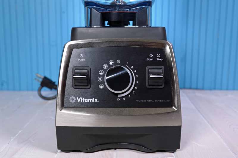 A close up of the base of the Vitamix 750 Professional Series Blender on a blue background.