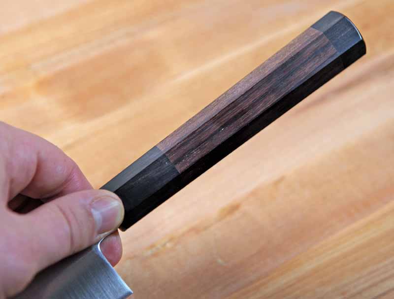 Closeup of the octagonal rosewood handle on the Yoshihiro Ice Hardened 10.5-Inch Stainless Steel Wa Sujihiki.