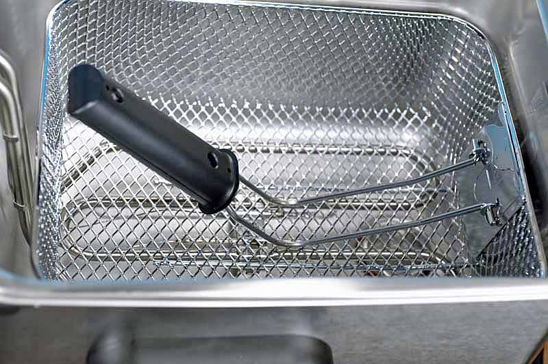 A close up of the folding handle on the fryer basket.