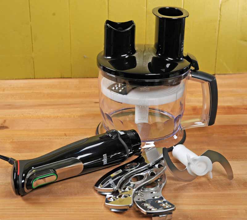 The motorized base of the Braun MQ777 with the 6 cup food processor and four blade attachments.