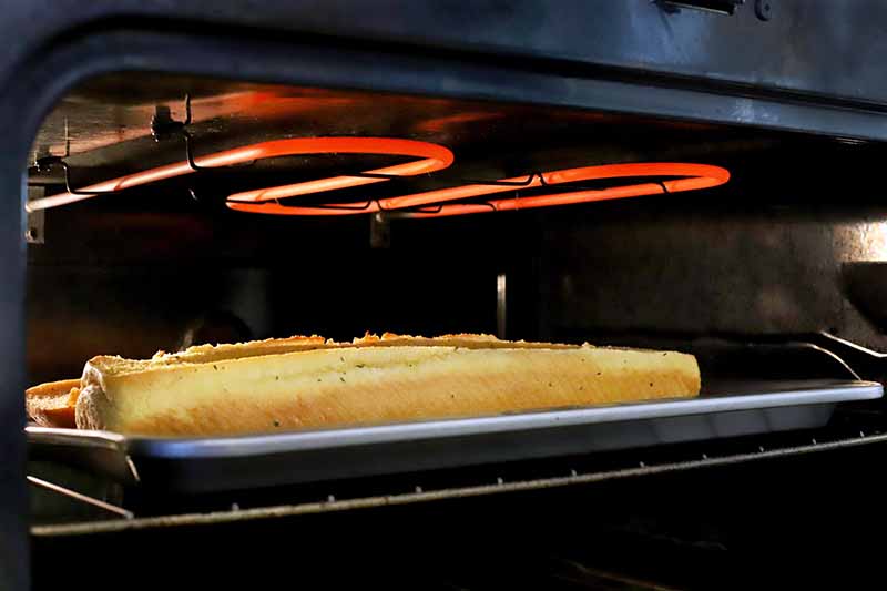 Breadsticks baking in an electric oven.