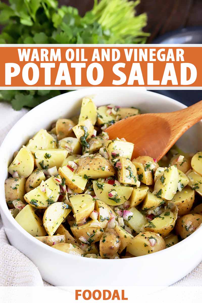 Vertical image of a spoon mixing together potato salad in a white bowl, with text on the top and bottom of the image.