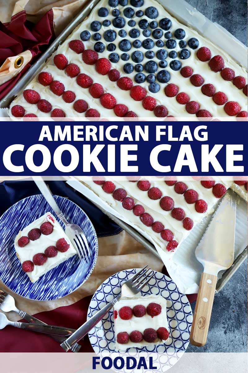 Top view of an American flag cookie cake made with raspberries and blueberries. The bulk of the cake is still intact in its sheet pan with two pieces on blue ceramic plates.