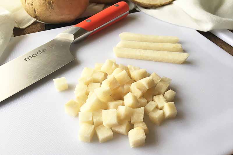 Horizontal image of cubed and matchstick jicama pieces.