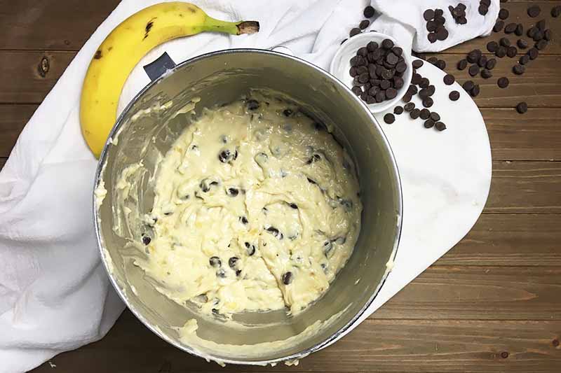 Horizontal image of a thick batter with chocolate chips in it.