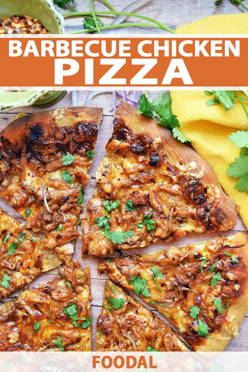 Overhead closely cropped vertical image of barbecue chicken pizza topped with cilantro, on a wood surface with a yellow cloth, sprigs of fresh herbs, and a small cup of crushed red pepper flakes, printed with orange and white text near the top and at the bottom of the frame.