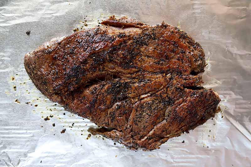 Horizontal image of seared and seasoned meat.