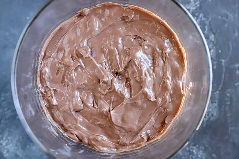 Horizontal image of chocolate pudding in a glass dish.