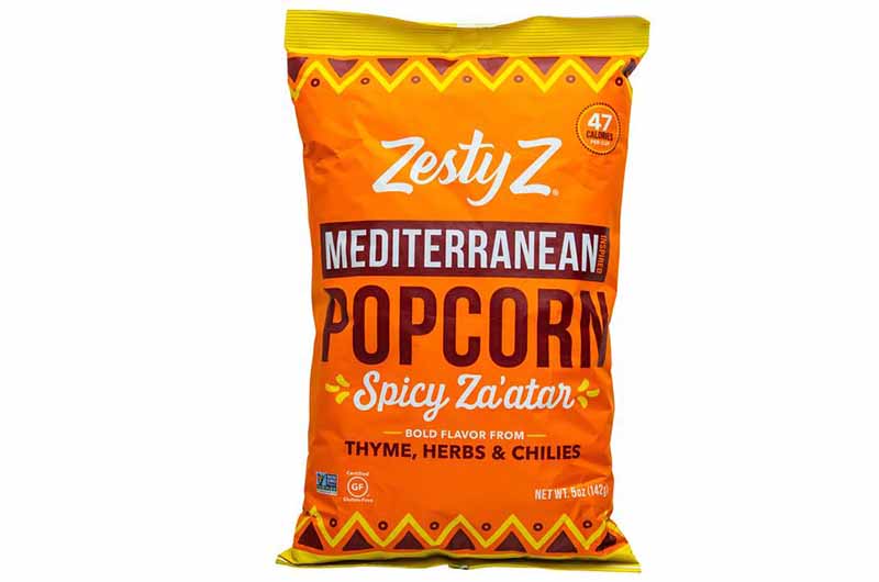 Image of an orange bag of Zesty Z's spicy za'atar popcorn.