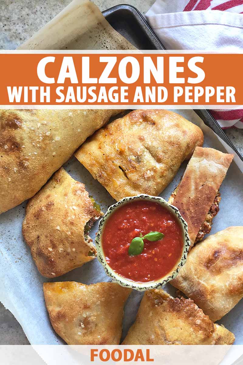 Vertical image of calzones cut in assorted sizes on a baking sheet with a bowl of marinara, with text on the top and bottom of the image.