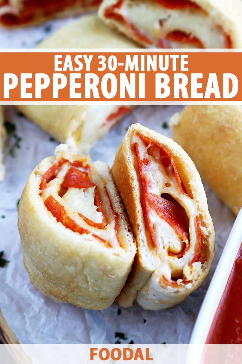 Vertical close-up image of two slices of pepperoni bread on parchment paper, with text on the top and bottom of the image.