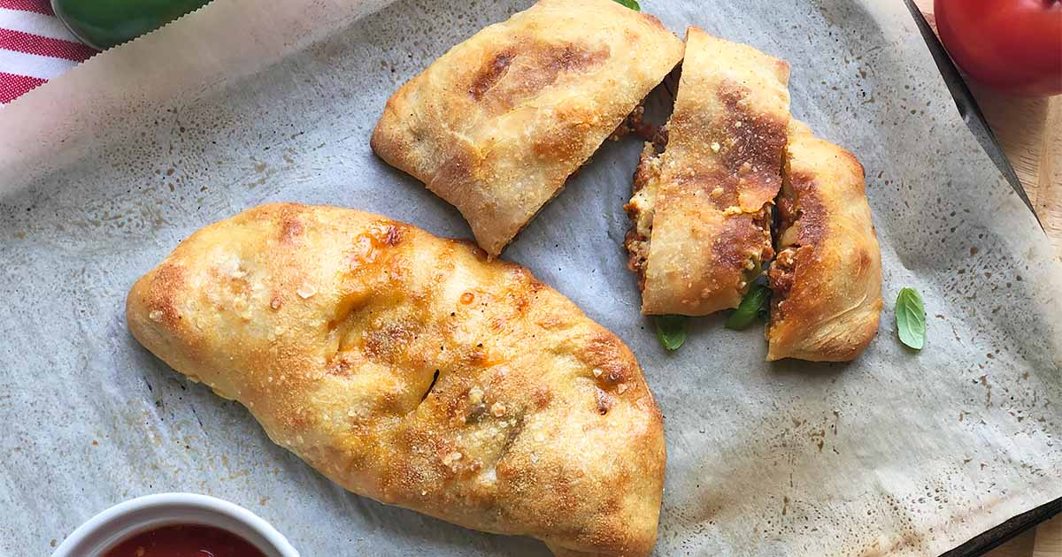Calzones with Sausage and Peppers Recipe | Foodal