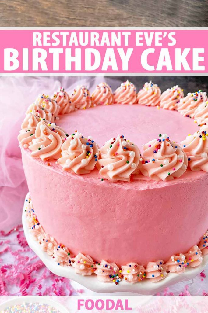 Vertical image of a whole pink frosted dessert with sprinkles on a white stand, with text on the top and bottom of the image.