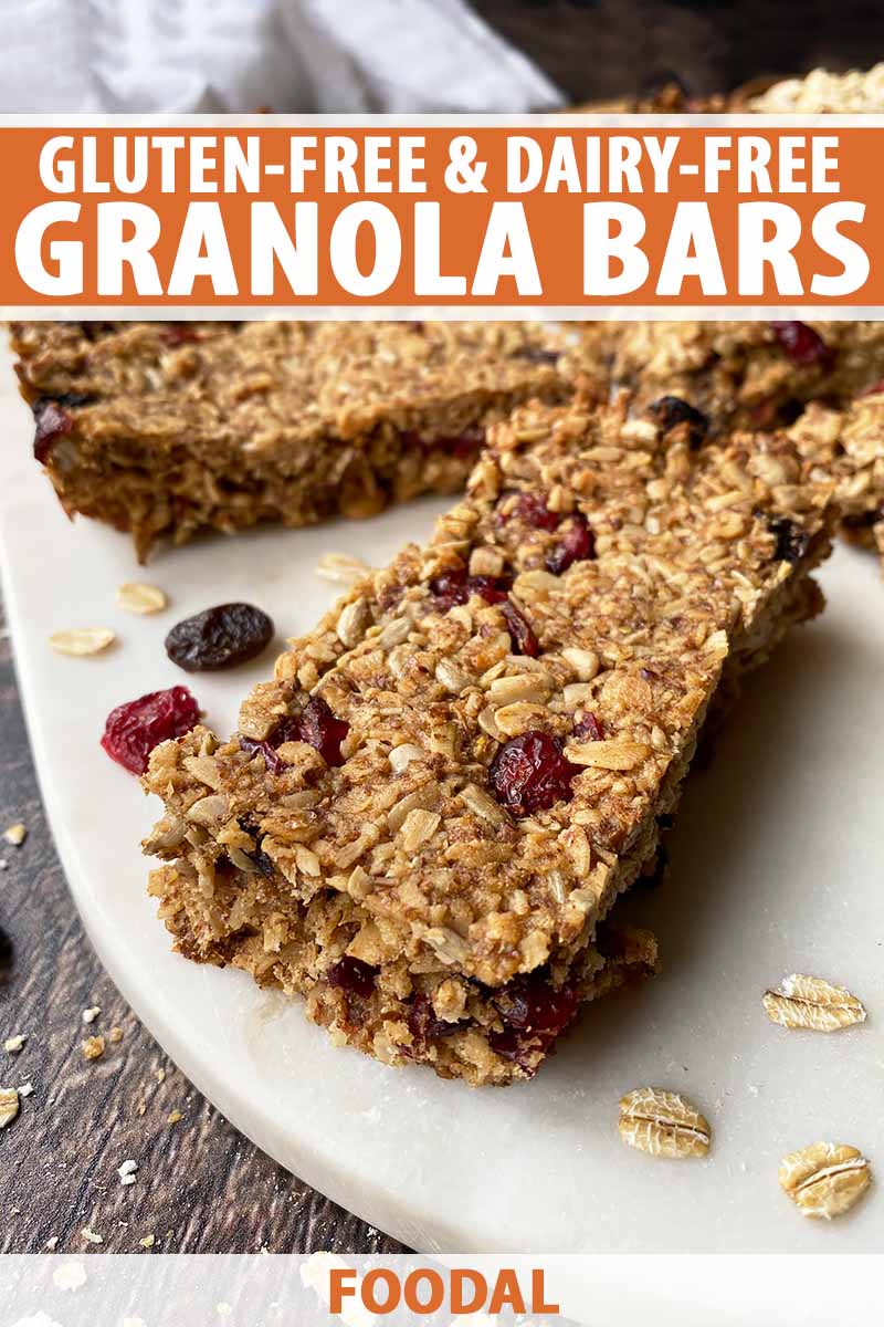 Vertical image of granola bars on a white surface with text on the top and bottom of the image.