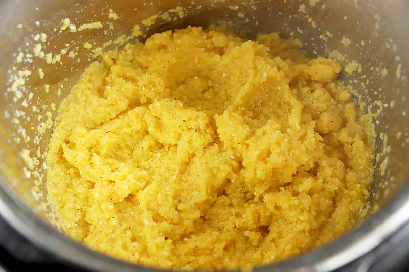 Horizontal image of thick cornmeal in a pot.
