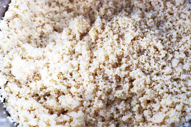 Horizontal close-up image of fluffy couscous.