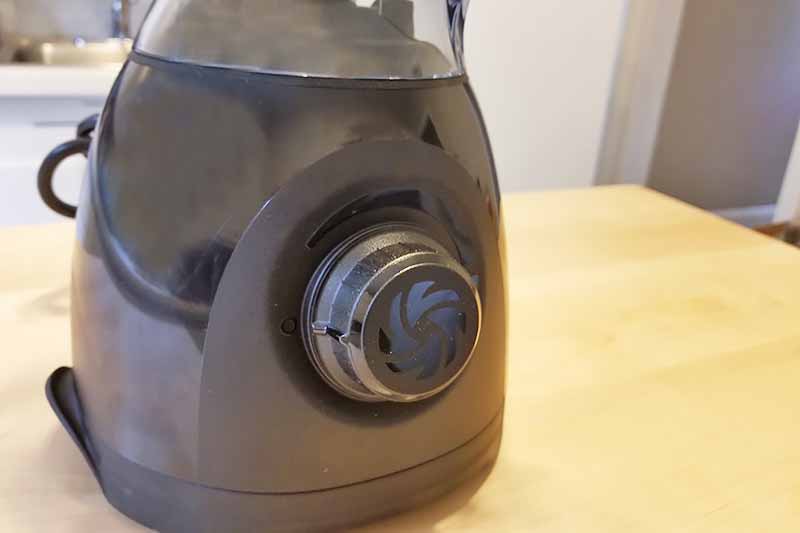 Horizontal image of the base of a small blender on a countertop.